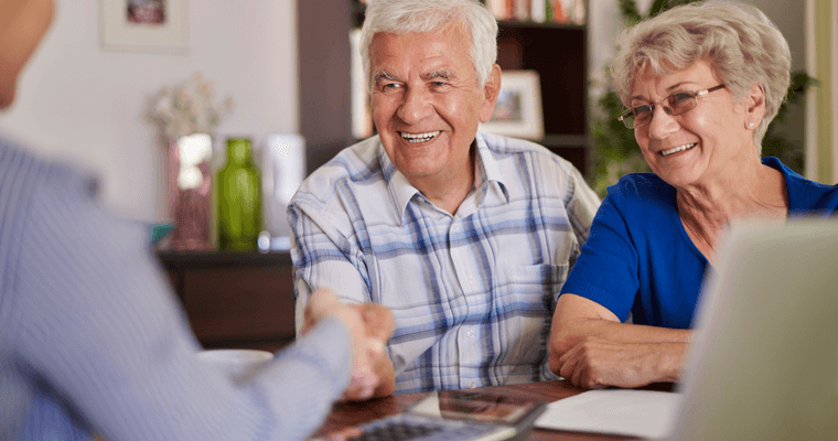 A couple reviewing their retirement accounts together at home