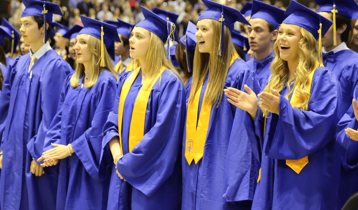 Graduating seniors in caps and gowns at commencement