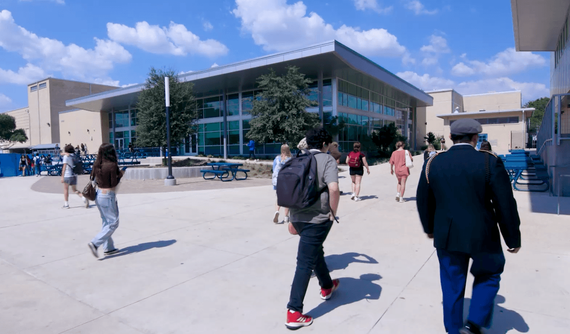 Students crossing the plaza outside Alamo Heights High School